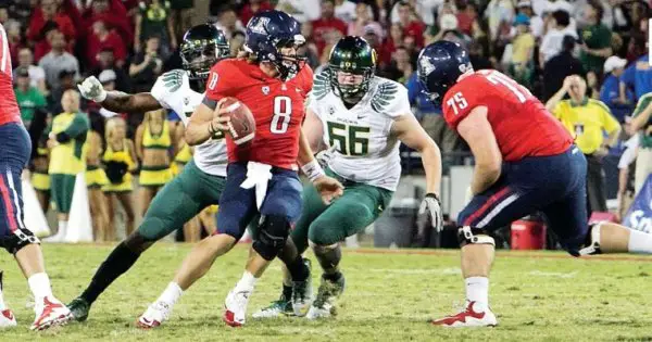 Taylor Hart closing in on Nick Foles sack_Amazing Moments Photography.jpg
